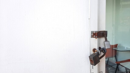 Old padlock on door background with copy space.