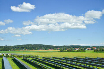 field with solar plants beside the highway, rural landscape germany