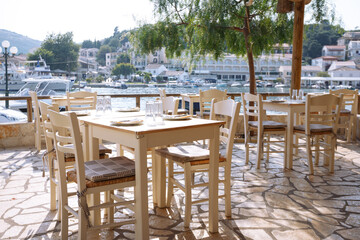 empty waterfront cafe and serving tables