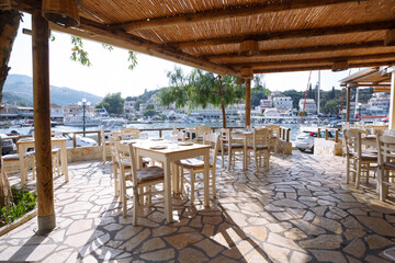 empty waterfront cafe and serving tables