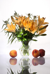 Bouquet with lilies and peaches on a light background