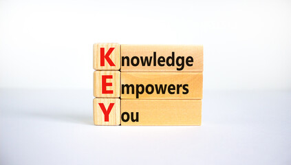 KEY, knowledge empowers you symbol. Wooden blocks with words 'KEY, knowledge empowers you'. Beautiful white background, copy space. Business, educational and KEY, knowledge empowers you concept.