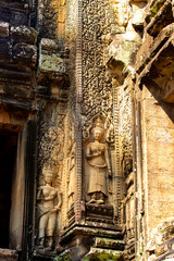 The engraved pattern around Angkor Wat belongs to the Khmer Empire. Located in the center of Angkor Thom