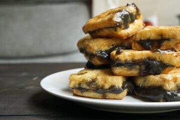 Tahu petis is Javanese traditional snack made from fried tofu with black shrimp paste or petis.
