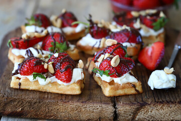 Waffles with cream cheese and strawberries. Healthy breakfast or dessert.
