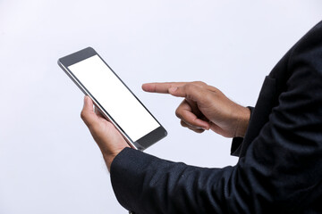 Young indian businessman using tablet over white background.