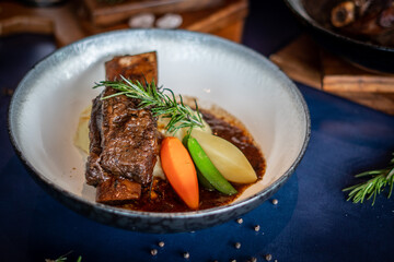 Beef Bourguignon. Stew with carrots, onions, mushrooms, bacon, garlic and bouquet garni.
