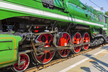 Green retro steam locomotive on the railway platform of the Rizhsky station. Moscow, Russia