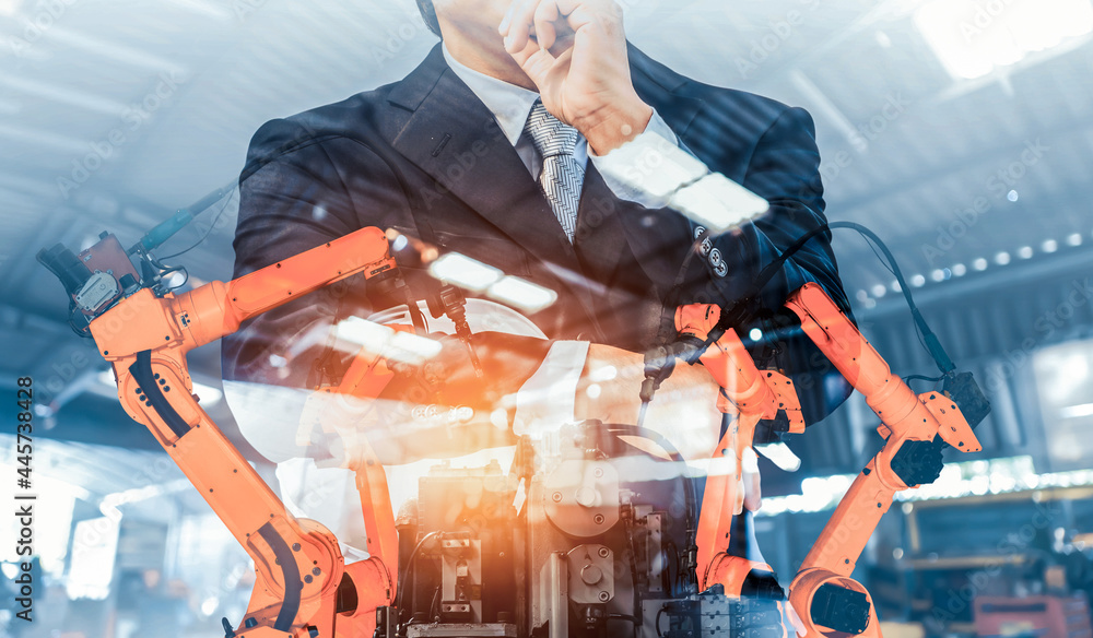 Poster mechanized industry robot arm and factory worker double exposure . concept of robotics technology fo