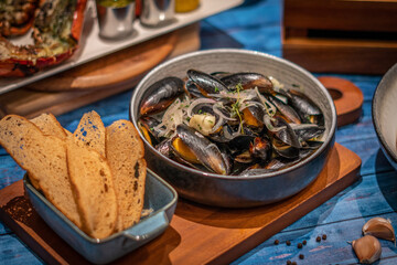 Mussels panorama with wine, and toasts