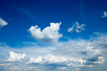 Naklejka na ściany i meble Blue sky background with a tiny clouds