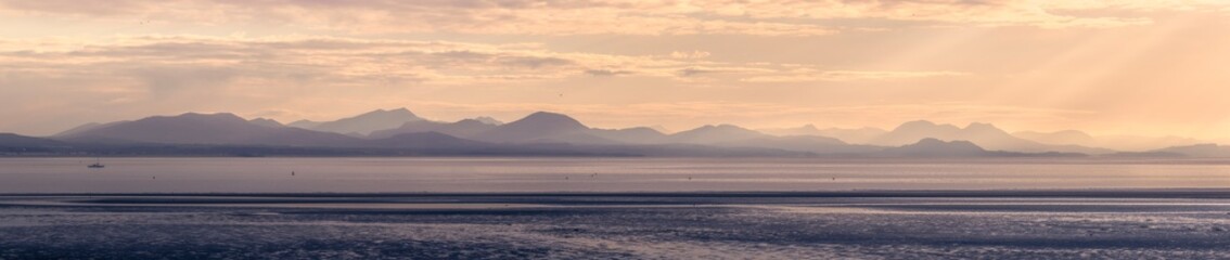 Sunrise over Sea and Mountains