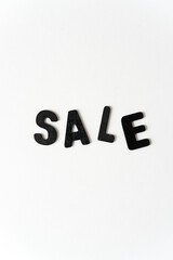 sale in black chalk letters on white