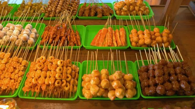 indonesian food in traditional restaurant. angkringan java cuisine. various skewer