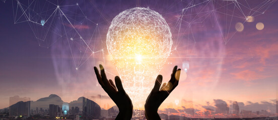Creativity on connectivity.Innovative idea.Inspiration and network. Hands holding light bulbs as...
