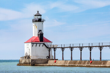 With its elevated catwalk, the East Pierhead Light, a historic lighthouse on Lake Michigan, marks...