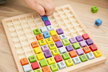 Mats educational game. To develop fine motoric skills, logical thinking, tool for primary school pupils and aspiring maths pros. Colorful wood cubes with numbers, digits, basic arithmetic operations