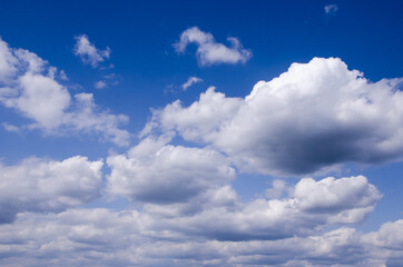 blue sky clouds of different sizes