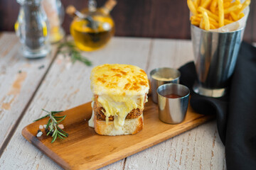 Seabass Burger with chips on wooden board