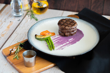 Grill Wagyu beef tenderloin with mashed Japanese potato, asparagus, red wine sauce