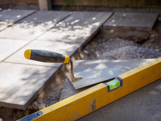 Laying patio slabs and landscaping a new outdoor floor in a garden makeover