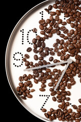clocks dial filled with coffee beans, time to drink coffee