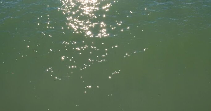 Shimmer and ripples on the water at sunset