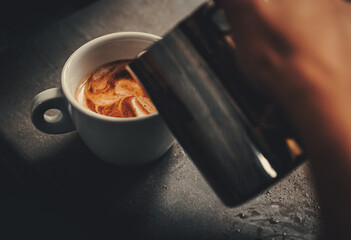 Barista hand making cappuccino Coffee in cafe