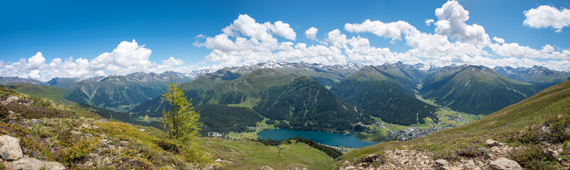 Naklejka na ściany i meble panorama lookout from Parsenn ridgeway to lake and tourist resort Davos, swiss alps