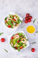 Delicious and healthy shrimp salad with herbs and tomatoes. Dietary nutrition for weight loss. Recipe for cooking fresh seafood. Mediterranean cuisine.