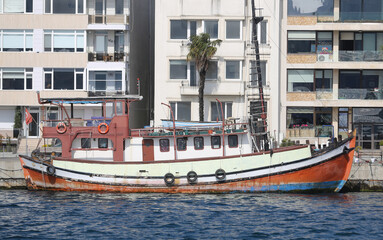 Fototapeta na wymiar Old Boat in Bosphorus Strait Side of Istanbul, Turkey
