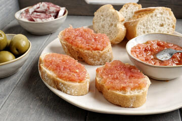 Bread with tomato (Pa amb tomaquet). Typical Catalan sandwich with grated tomato with olive oil.