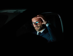 businessman laptop tablet night business computer man office technology light car vehicle young...