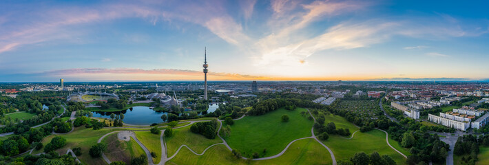 Idyllic view over Munich with some its popular landmarks at the Olympic Park with wonderful green parts combined with modern architecture. - obrazy, fototapety, plakaty