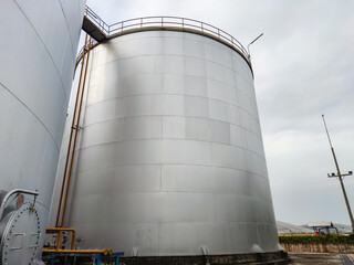 Oil storage tank In industrial areas. Crude oil storage plant For export. Palm oil factories in Asia. The atmosphere industry zone 