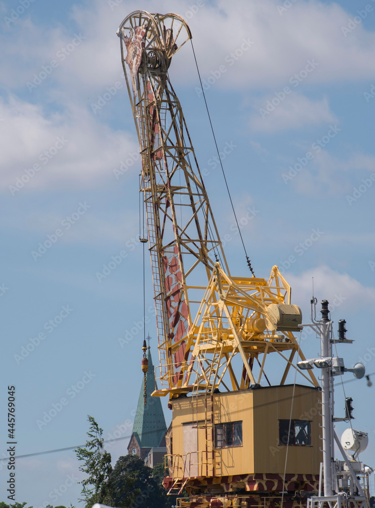 Wall mural giraffe painted pier crane in the harbor of stockholm