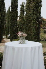 Bistro table adorned with flowers ready for a wedding reception