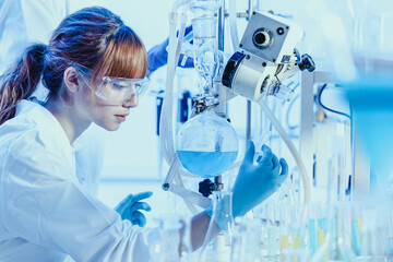 Young chemists researching in life science laboratory.