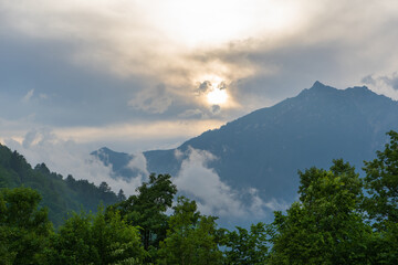 Clouds around the mountain Kramerspitz near Garmisch-Partenkirchen during sunset