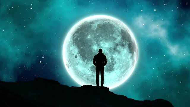 A man alone standing on a hill staring at the full moon bulan