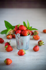 red ripe natural strawberries on a wooden table