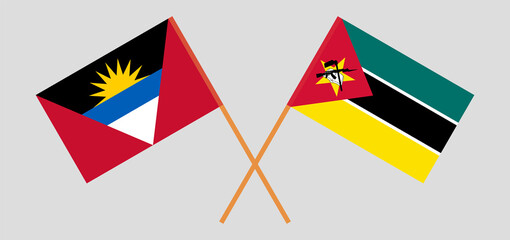 Crossed flags of Antigua and Barbuda and Mozambique. Official colors. Correct proportion