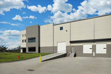 Fototapeta na wymiar Gray industrial warehouse factory building
