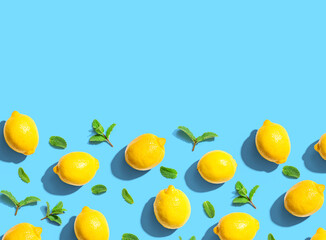 Fresh yellow lemons with mints overhead view