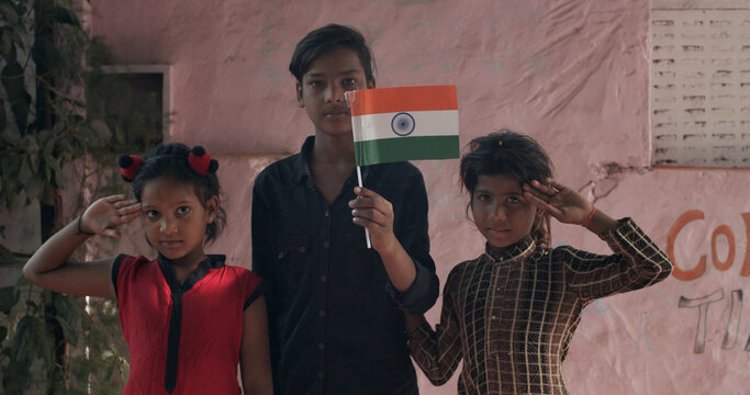 Group Of Patriotic Indian Kids Posing With An Indian Flag