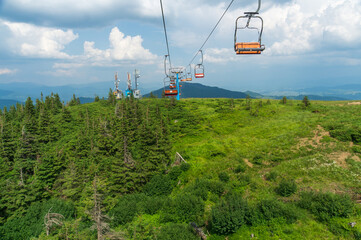 Landscape view of the mountains and old ski lift in summer. Dragobrat tourist place in Ukraine