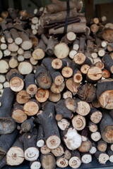 Round firewood lies in garage