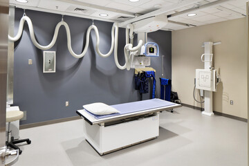 Room in hospital with medical equipment and table