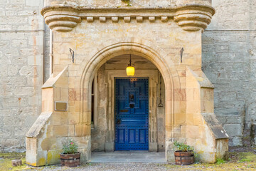 Fototapeta na wymiar Ornamental Blue Door in a Stone Portico in a Scottish Castle, Scotland, U.K.