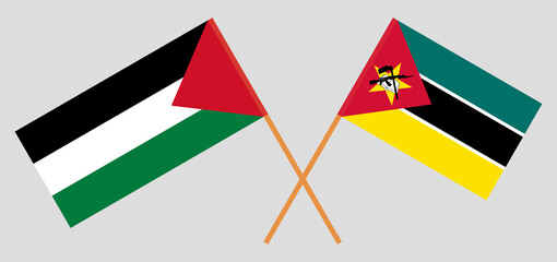 Crossed flags of Palestine and Mozambique. Official colors. Correct proportion